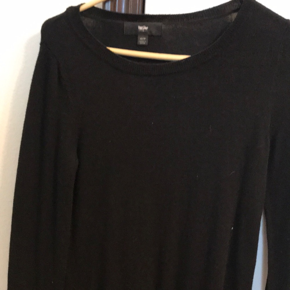 Long sleeve black sweater.
